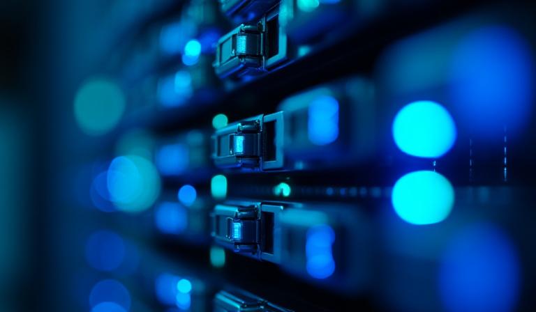 Close-up of high-speed data servers with blue neon lighting